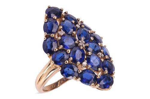 Lot 51 - A sapphire dress ring, the lozenge panel, claw-...