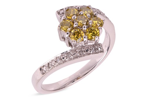 Lot 170 - A diamond floral cluster crossover ring in...