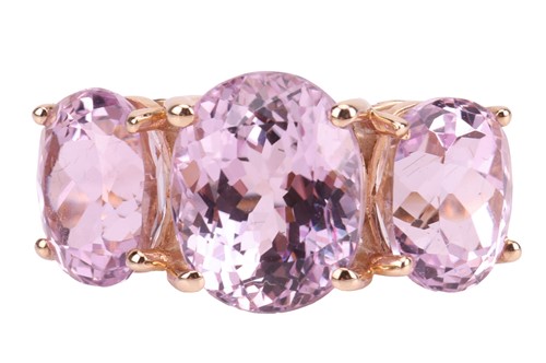 Lot 10 - A three-stone kunzite ring in 9ct gold,...