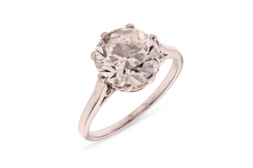 Lot An early 20th century diamond solitaire ring,...