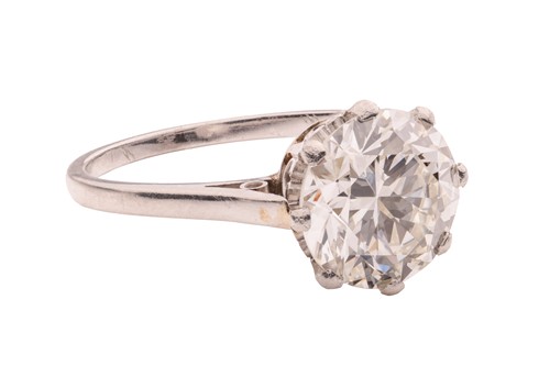 Lot An early 20th century diamond solitaire ring,...