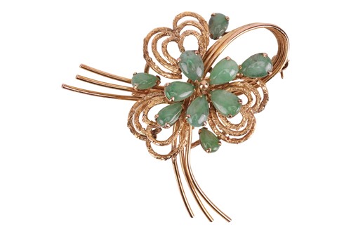 Lot 100 - A stylised spray brooch set with jadeite, wire...