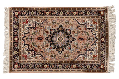 Lot 119 - An Indian rug of Heriz design, late 20th...