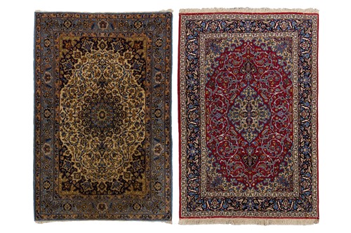 Lot 123 - An Isfahan rug, with deep red ground, central...