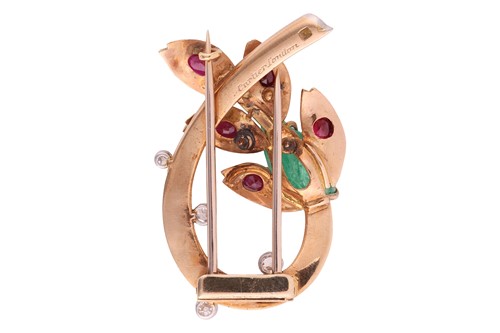 Lot Cartier - a spray clip brooch set with emerald,...