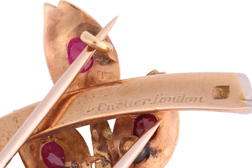 Lot Cartier - a spray clip brooch set with emerald,...