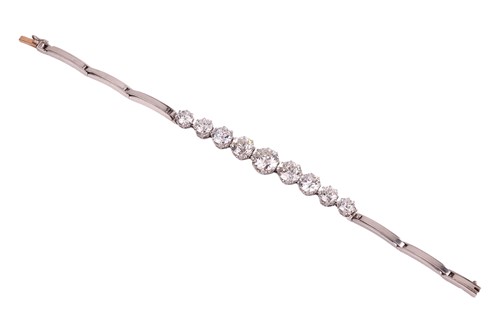 Lot A nine-stone graduated diamond bracelet, with...