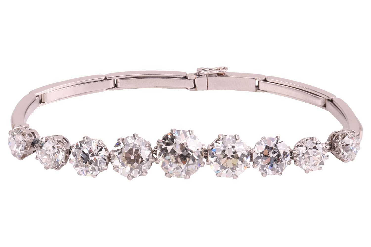 Lot A nine-stone graduated diamond bracelet, with...