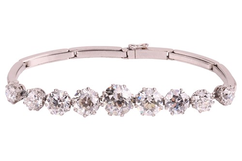 Lot A nine-stone graduated diamond bracelet, with...
