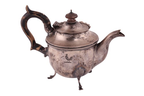 Lot 326 - An Irish silver bachelor teapot; circular,...