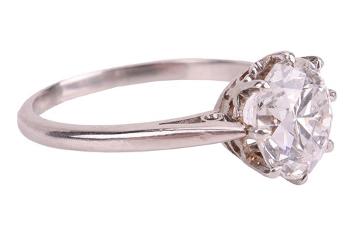 Lot 56 - A transitional-cut diamond solitaire ring,...
