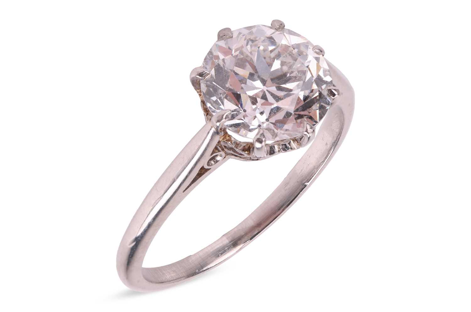 Lot 56 - A transitional-cut diamond solitaire ring,...