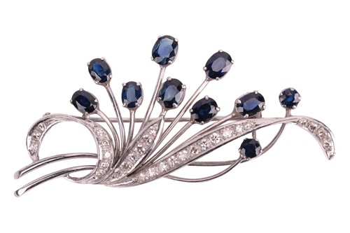Lot 86 - A sapphire and diamond spray brooch, the...
