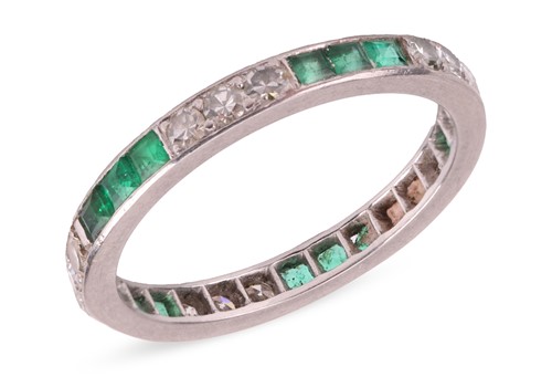Lot 71 - A late Art Deco eternity ring, comprising...