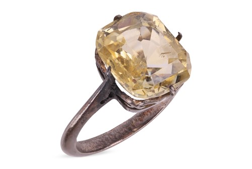 Lot 69 - A yellow sapphire ring, claw-set with a...