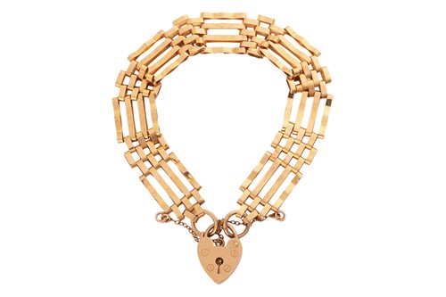 Lot 144 - A gate link bracelet in 9ct yellow gold, the...
