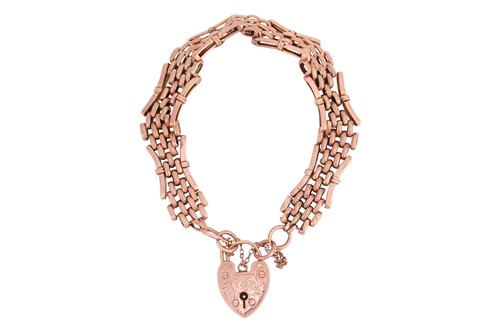 Lot 19 - A gate link bracelet with heart clasp,...