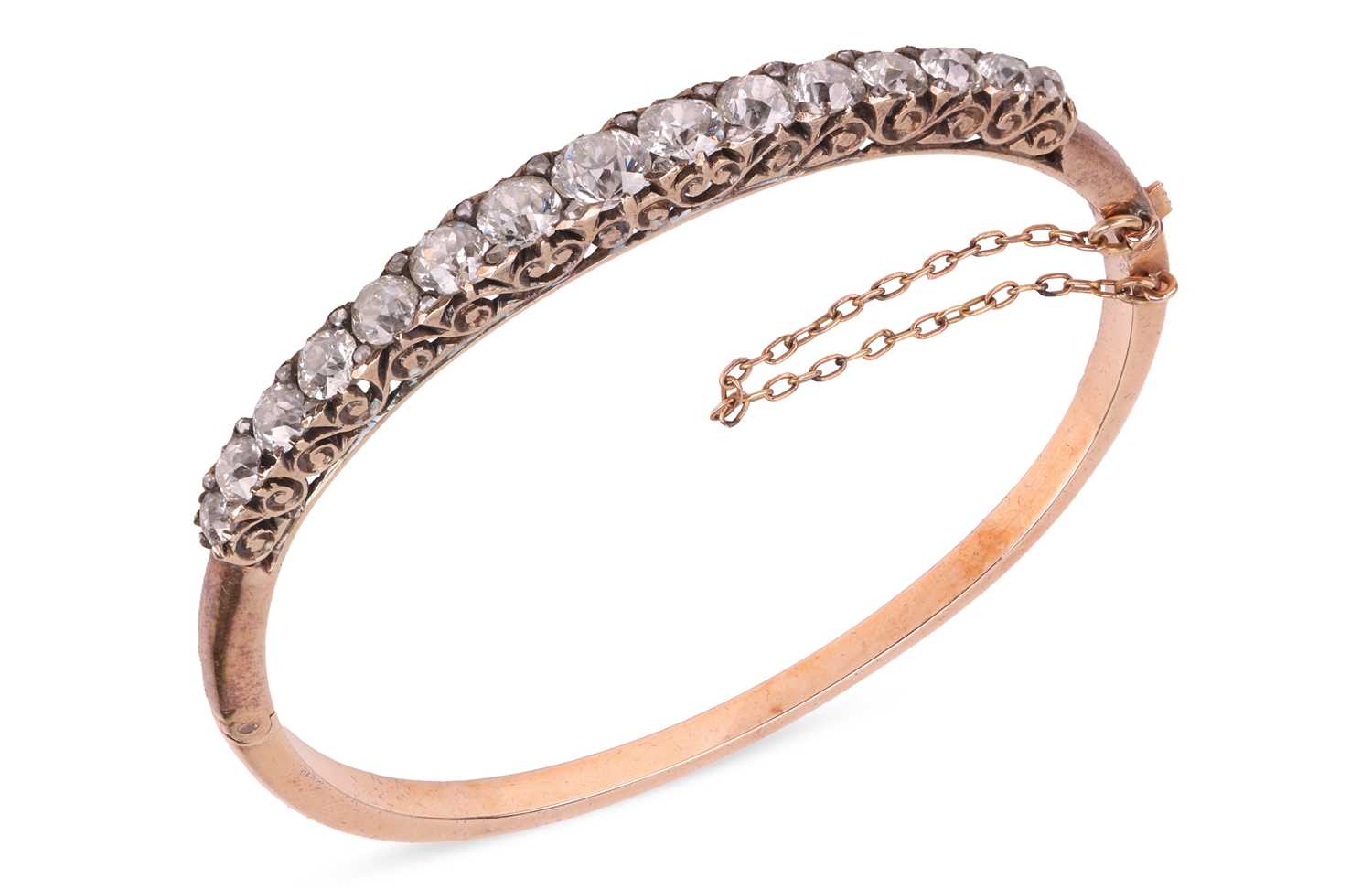 Lot A late Victorian half hoop diamond bangle, the...