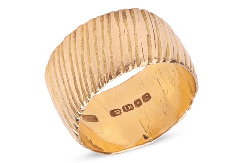 Lot An 18ct gold band ring, the textured band,...
