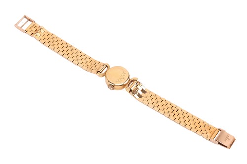 Lot Universal Geneve – An 18ct Gold Dress Watch...