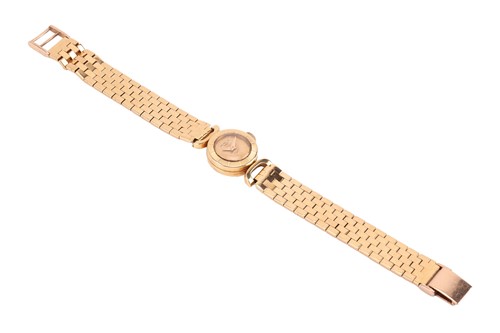 Lot Universal Geneve – An 18ct Gold Dress Watch...