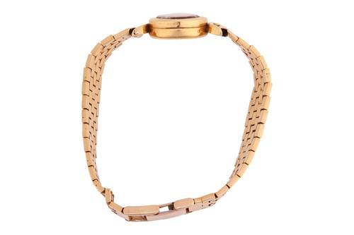 Lot Universal Geneve – An 18ct Gold Dress Watch...