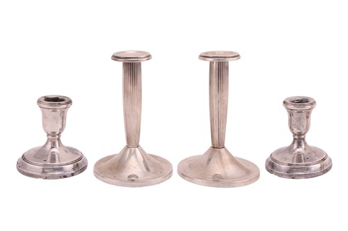 Lot 258 - A pair of white metal candlesticks, possibly...