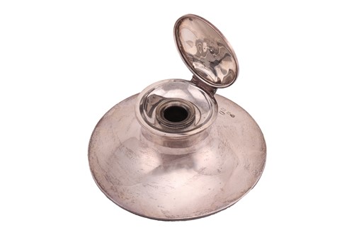 Lot A silver inkwell by Asprey, of circular form...