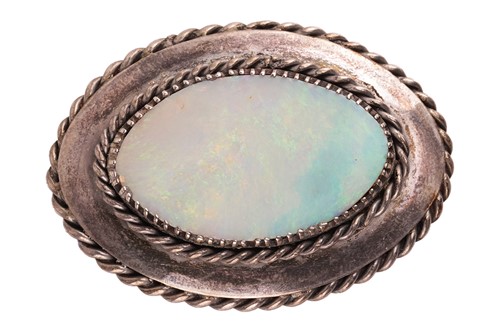 Lot An Arts and Crafts opal brooch, featuring an...