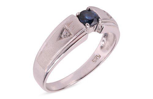 Lot 110 - A sapphire and diamond three-stone ring, the...