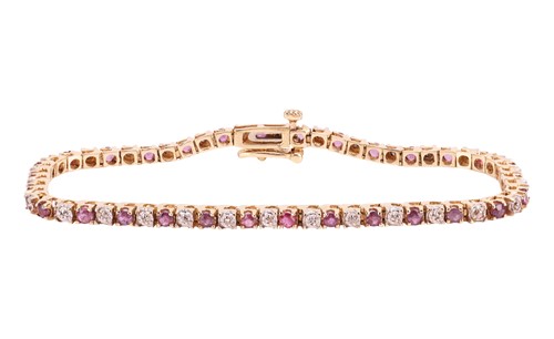 Lot 131 - A ruby and diamond bracelet, the highly...