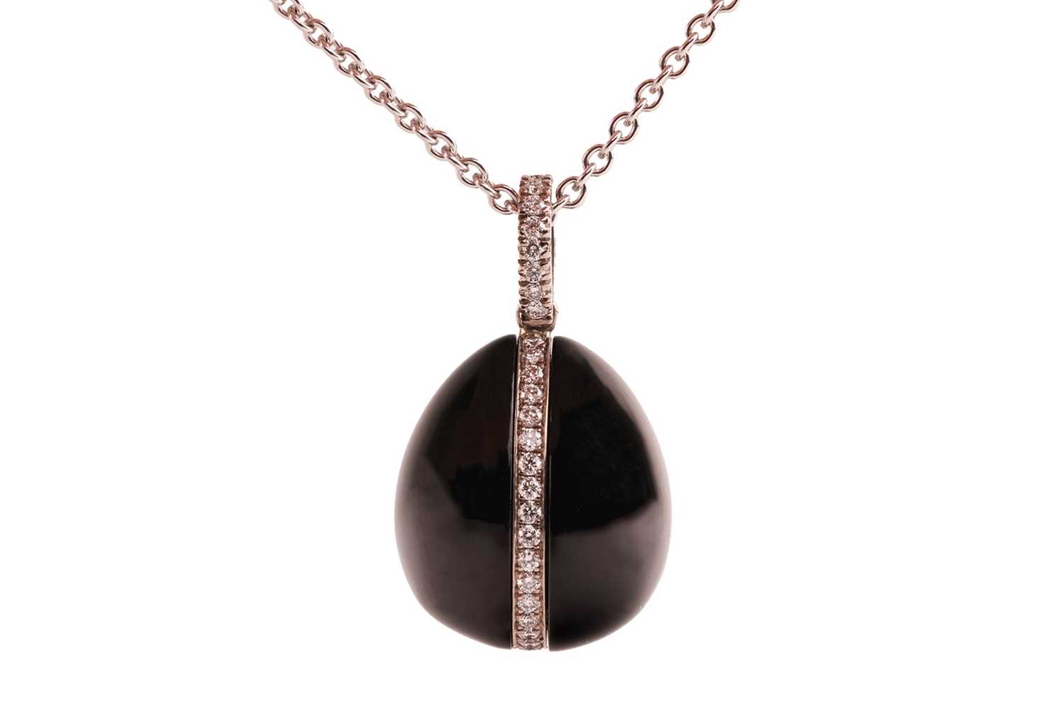 Lot Fabergé - a Whitby jet and diamond egg pendant...