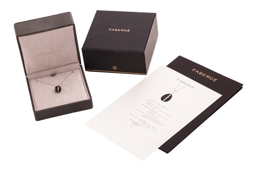 Lot Fabergé - a Whitby jet and diamond egg pendant...