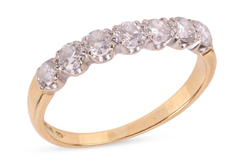 Lot A diamond half eternity ring, featuring seven...