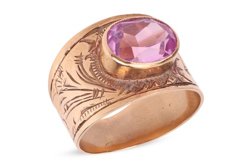 Lot 6 - A synthetic pink sapphire dress ring, the...