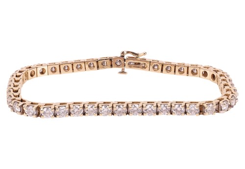 Lot A diamond tennis bracelet, featuring forty-two...