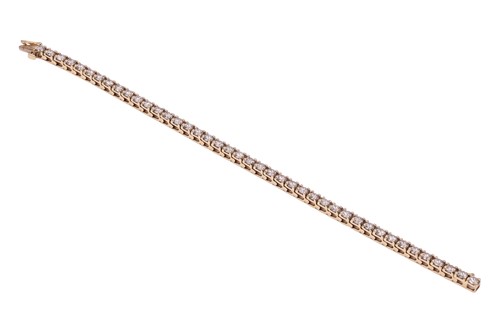 Lot A diamond tennis bracelet, featuring forty-two...