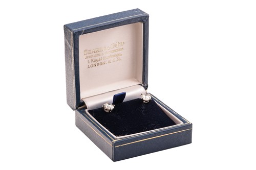 Lot A pair of diamond stud earrings, with a total...