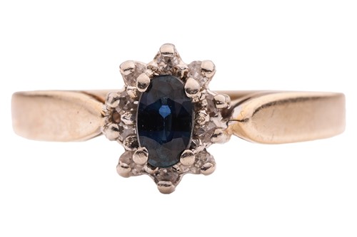 Lot 112 - A sapphire and diamond cluster ring, the...