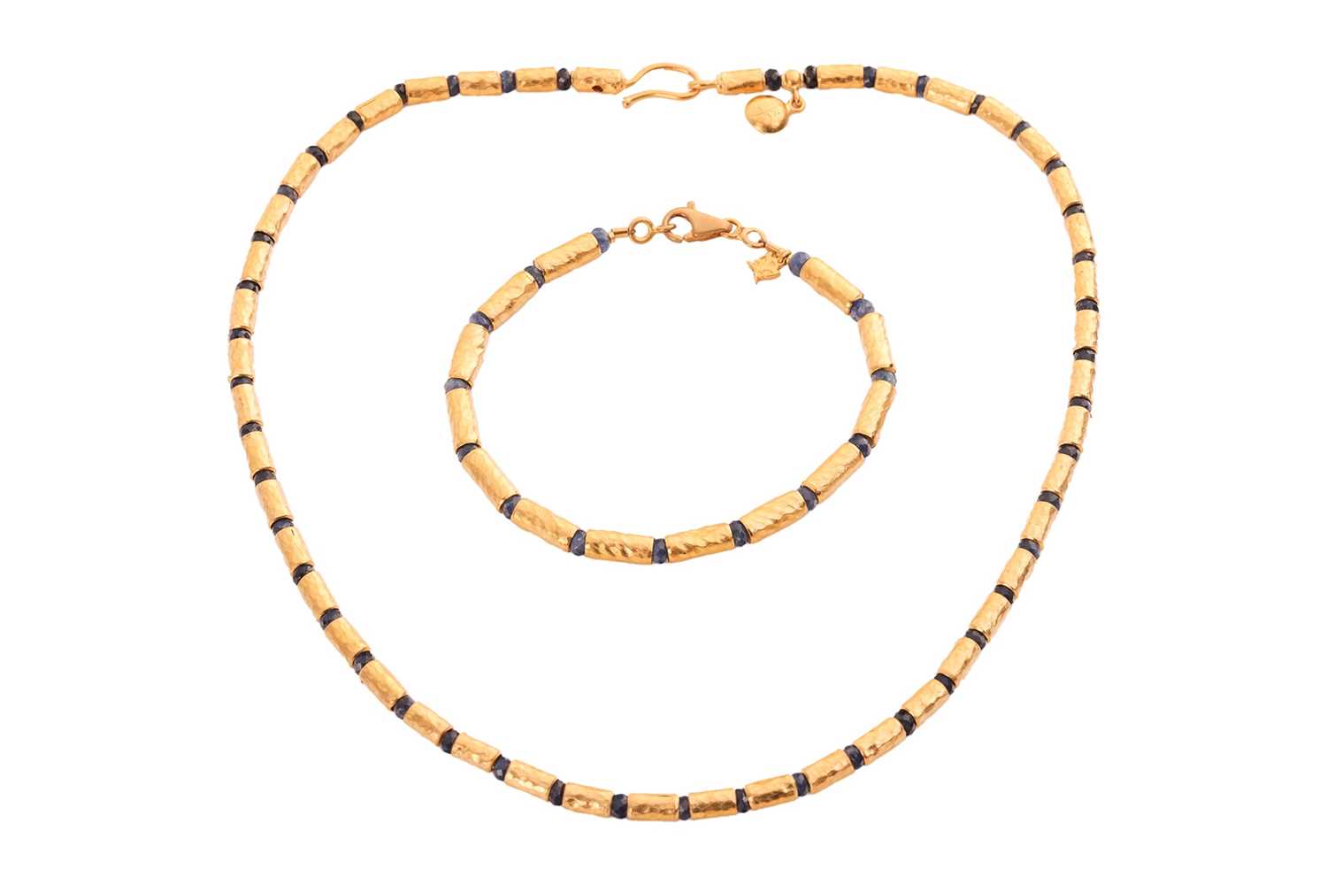 Lot A sapphire bead necklace and bracelet suite by...