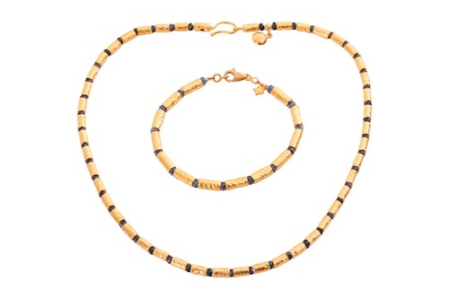 Lot A sapphire bead necklace and bracelet suite by...