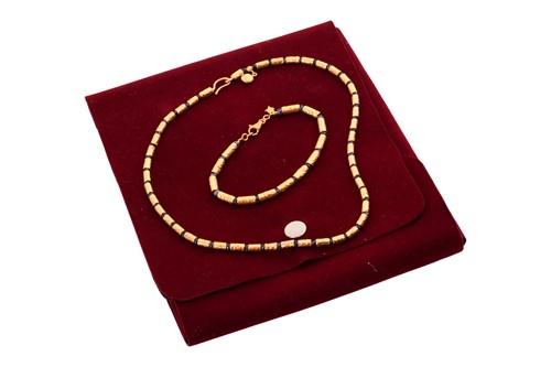 Lot A sapphire bead necklace and bracelet suite by...