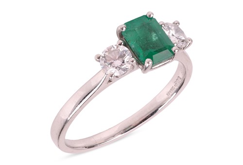 Lot 282 - An emerald and diamond three-stone ring, the...