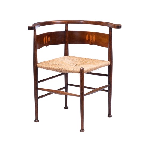 Lot An Arts and Crafts mahogany and inlaid corner...