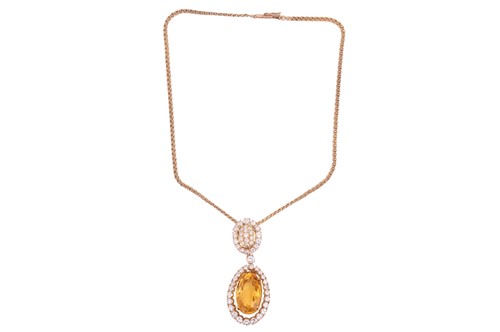 Lot 203 - A citrine and diamond drop pendant, composed...