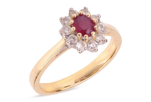 Lot 145 - A ruby and diamond cluster ring in 18ct gold,...