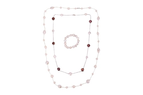 Lot 192 - Two pearl necklaces and a bracelet; The first...