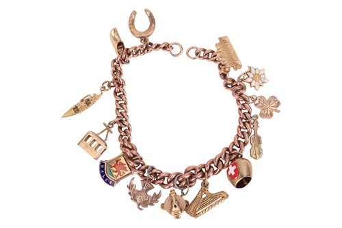 Lot 134 - A charm bracelet, the flat curb-link chain...