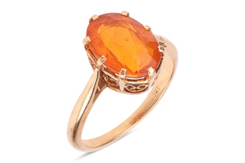 Lot 207 - A fire opal solitaire ring, oval-cut fire opal...