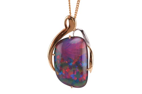 Lot An opal triplet pendant, containing a...